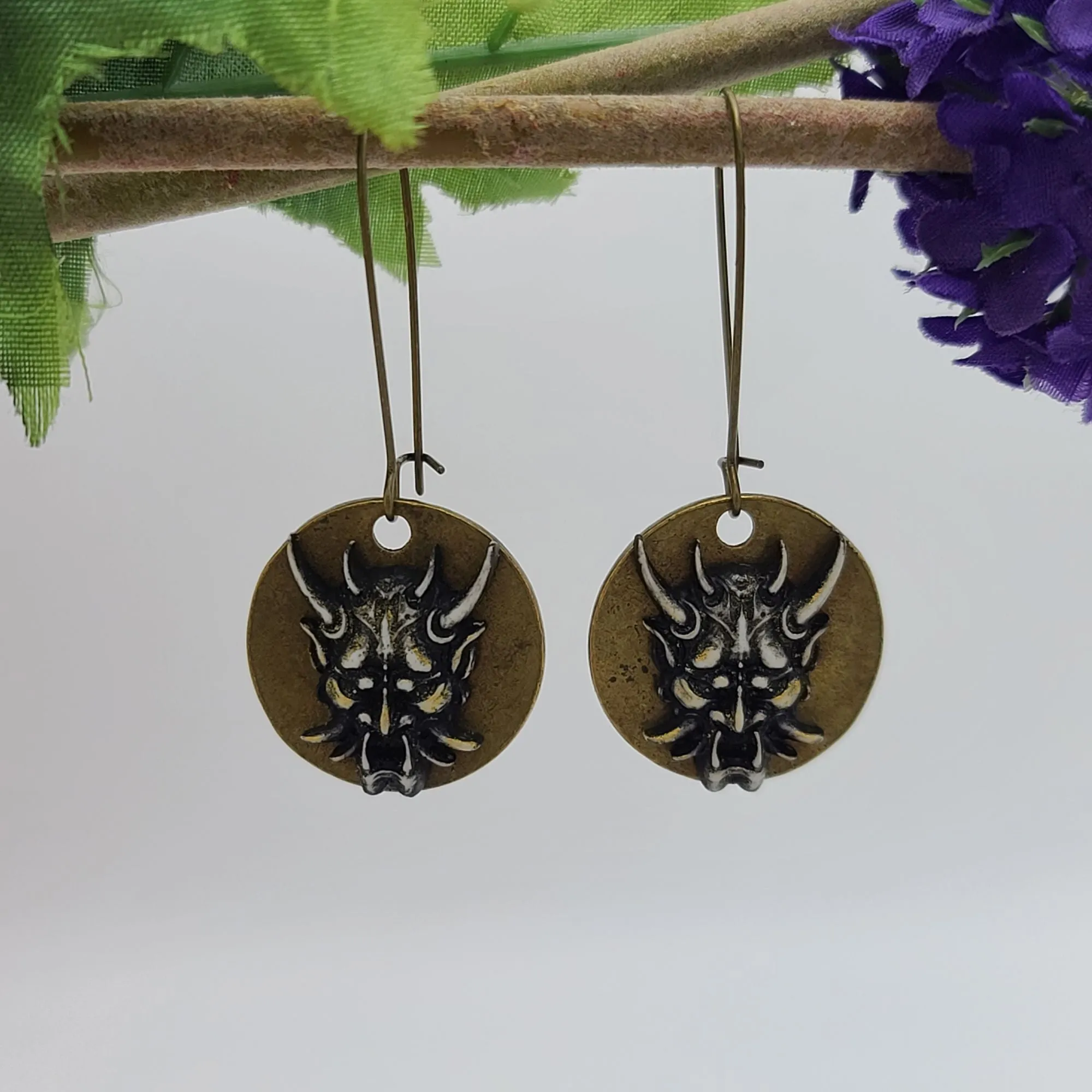 Mystical Devil Face Earrings for Gothic Fashion and Occult Jewelry Collection.