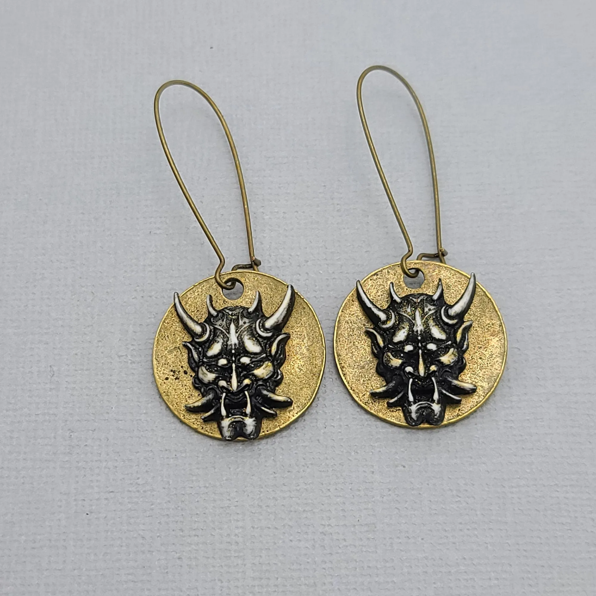 Mystical Devil Face Earrings for Gothic Fashion and Occult Jewelry Collection.